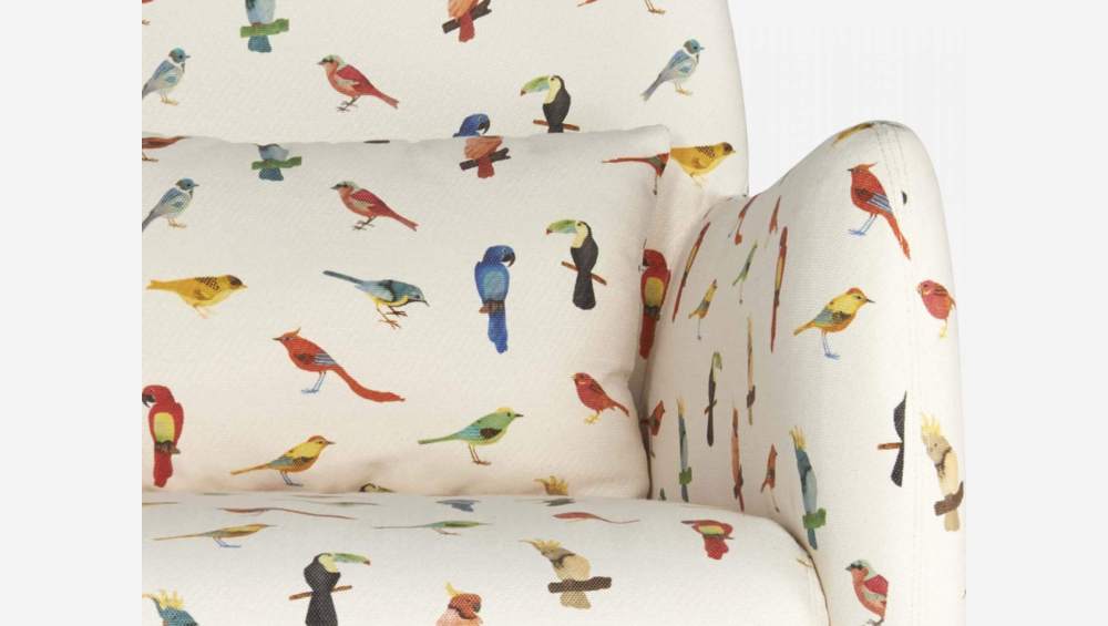 Fauteuil en tissu motif oiseaux et pieds en chêne