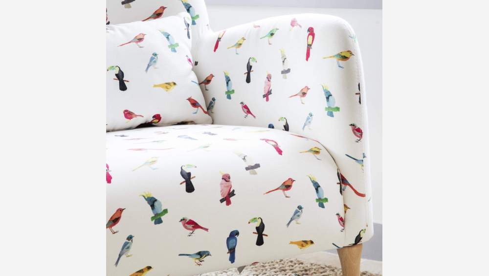 Fauteuil en tissu motif oiseaux et pieds en chêne