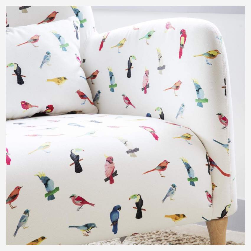 Fauteuil en tissu motif oiseaux et pieds en chêne