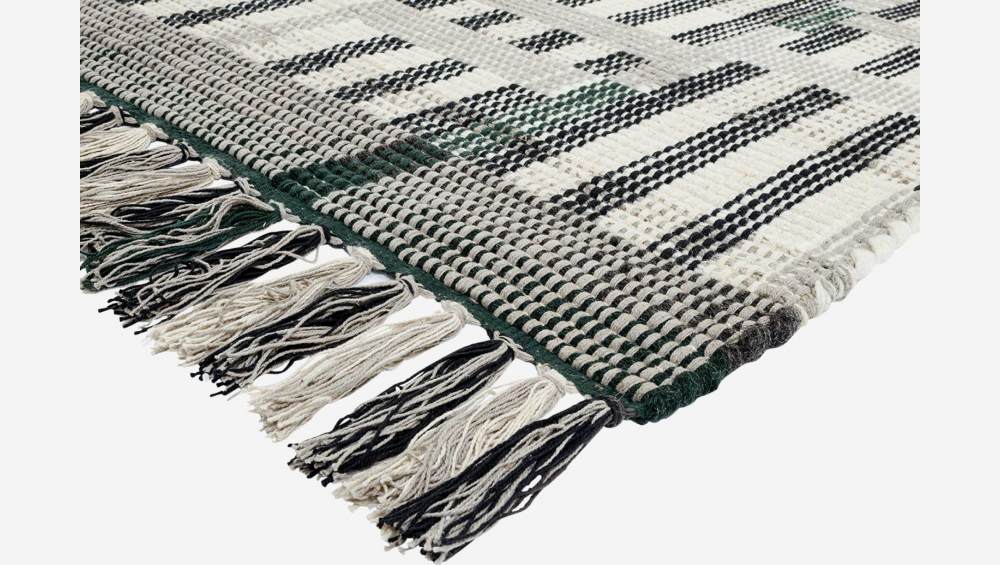 Gewebter Teppich aus Wolle - 170 x 240 cm - Schwarz und Weiß