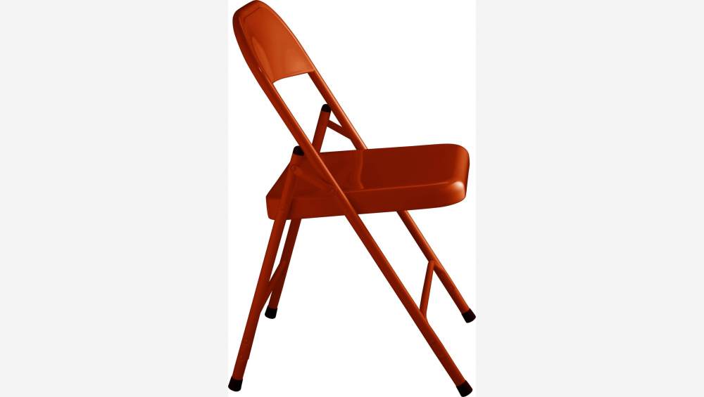 Chaise pliante orange en acier laqué