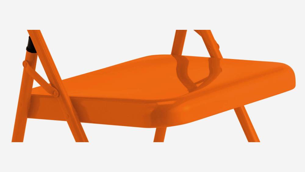 Chaise pliante orange en acier laqué