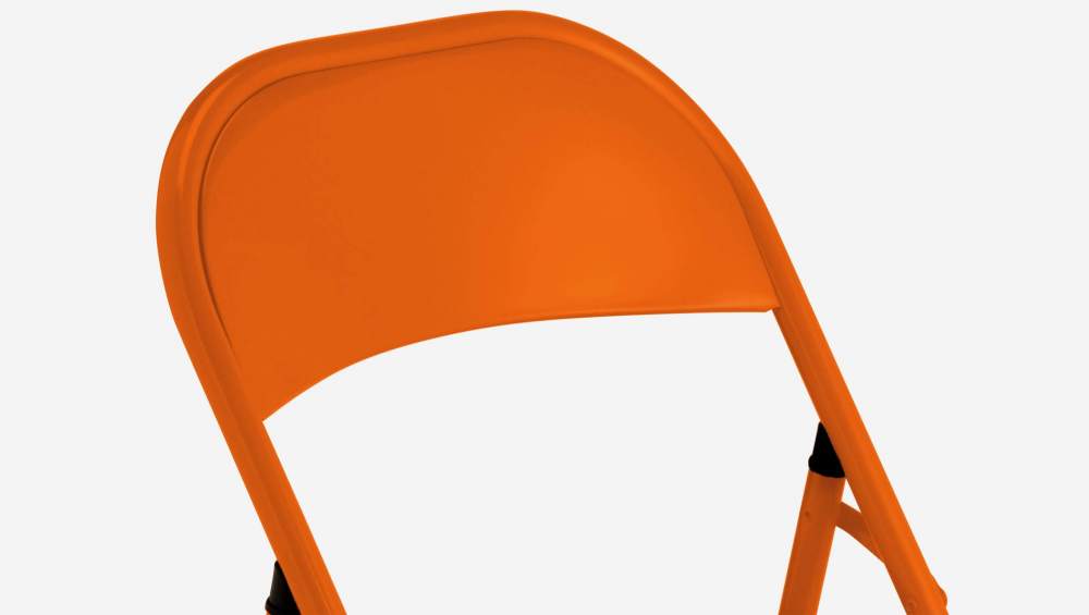 Chaise pliante orange en acier laqué